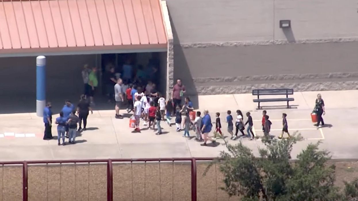 AZ police tase 2 parents and arrest another for allegedly trying to get their kids from grade school where armed intruder was reported