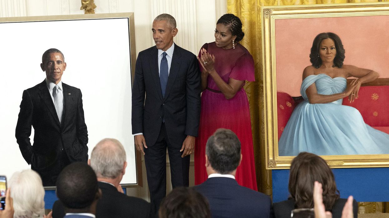 Michelle Obama takes a veiled swipe at Trump during ceremony to unveil White House portraits