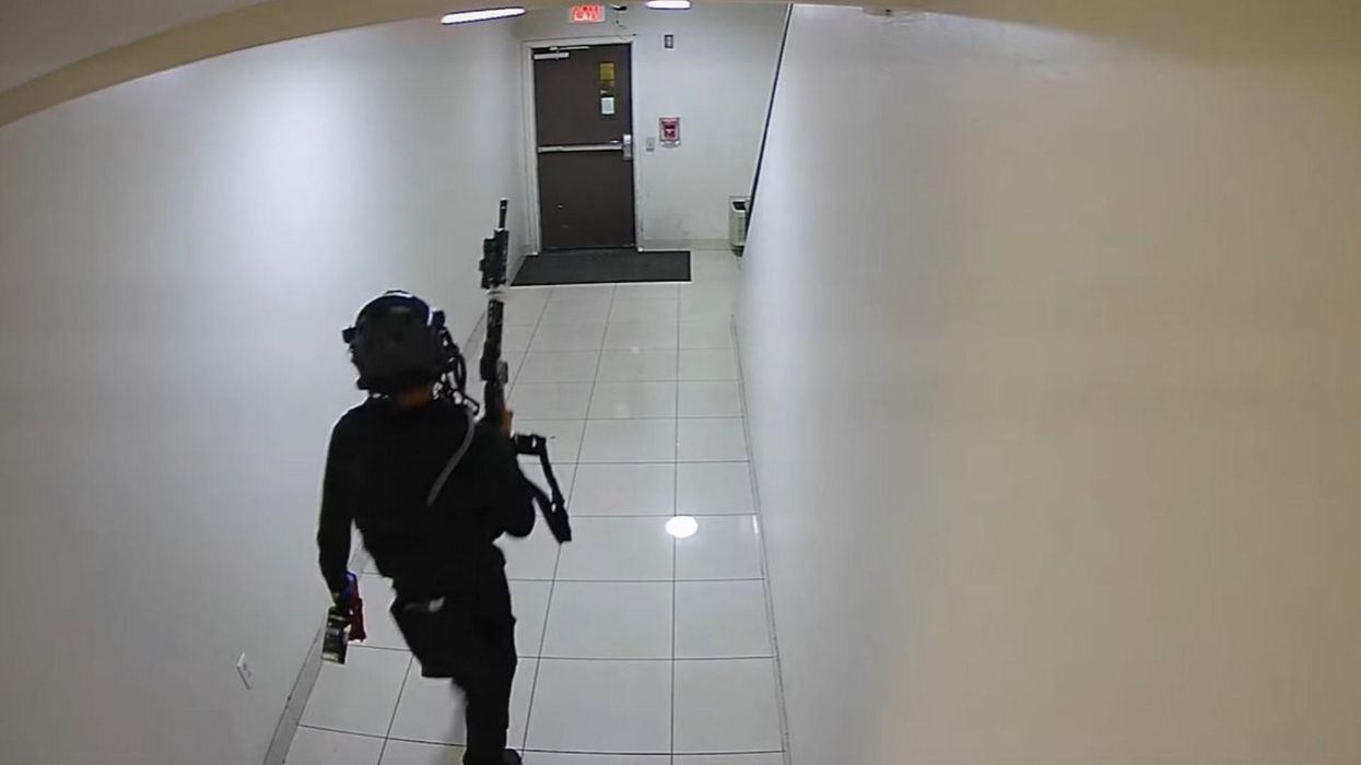 Police release haunting video of a deadly mass shooter in ballistic vest terrorizing Phoenix by rattling off 200 rounds and Molotov cocktail