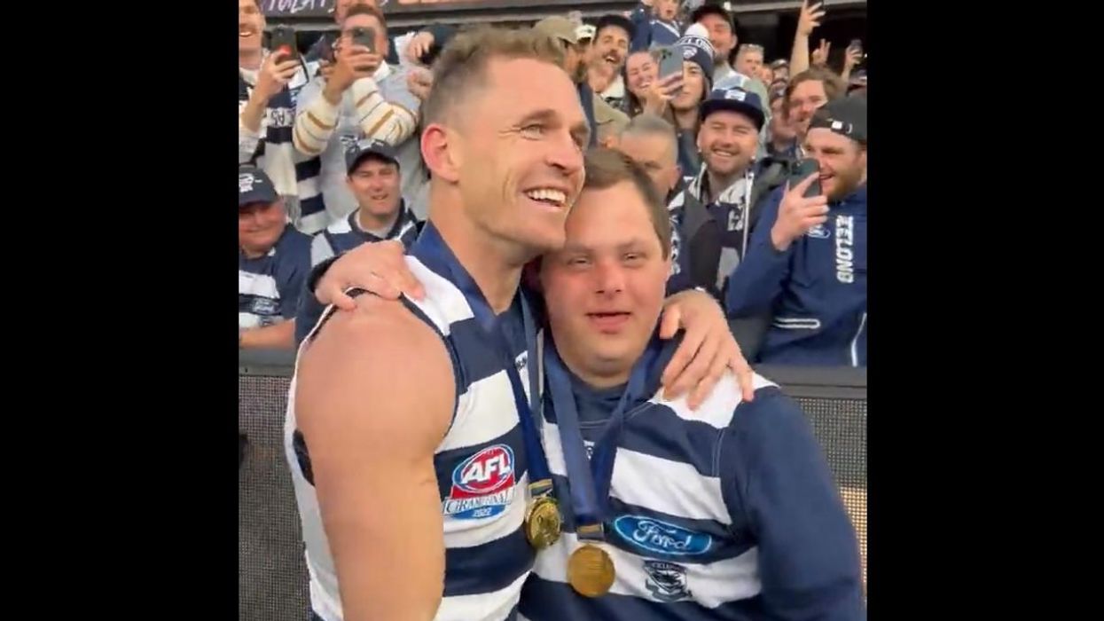 'We share a very special friendship': Aussie football captain and water boy with special needs celebrate together after title win