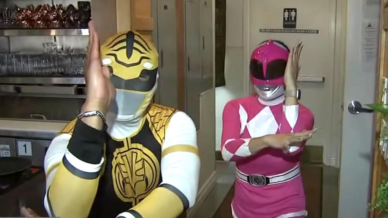 Restaurant servers dressed as Power Rangers rescue a woman being assaulted by a man