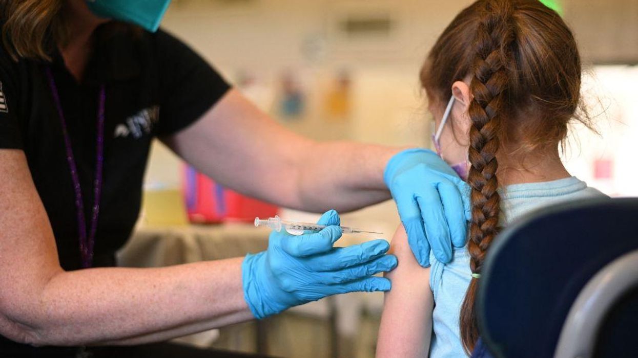 COVID-19 vaccines should be added to immunization schedules for kids and adults, CDC advisory panel recommends