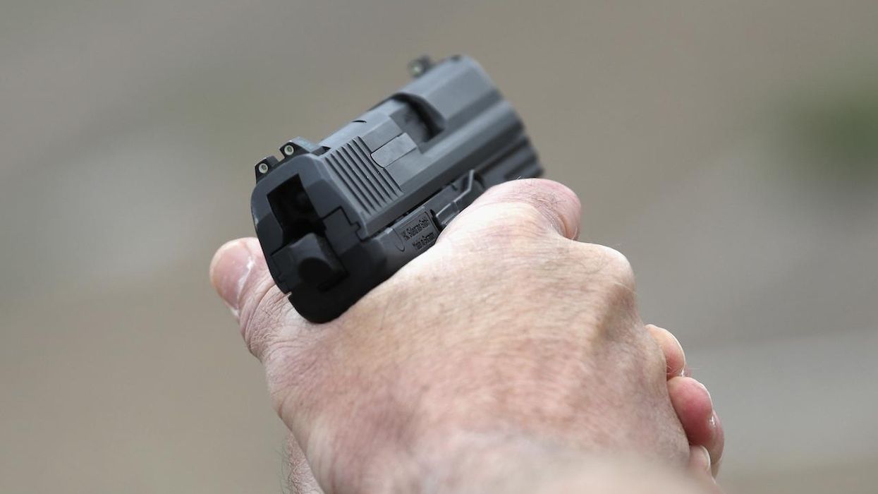 Good guy with a gun draws weapon as pregnant woman is beaten, stomped by her boyfriend — and the brutal attack ends right there