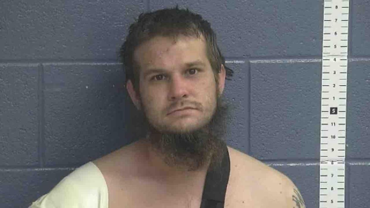 Chainsaw-wielding fugitive walks toward deputy, who orders him to put it down. Instead, fugitive grabs shotgun, points it at deputy — who then opens fire on suspect.