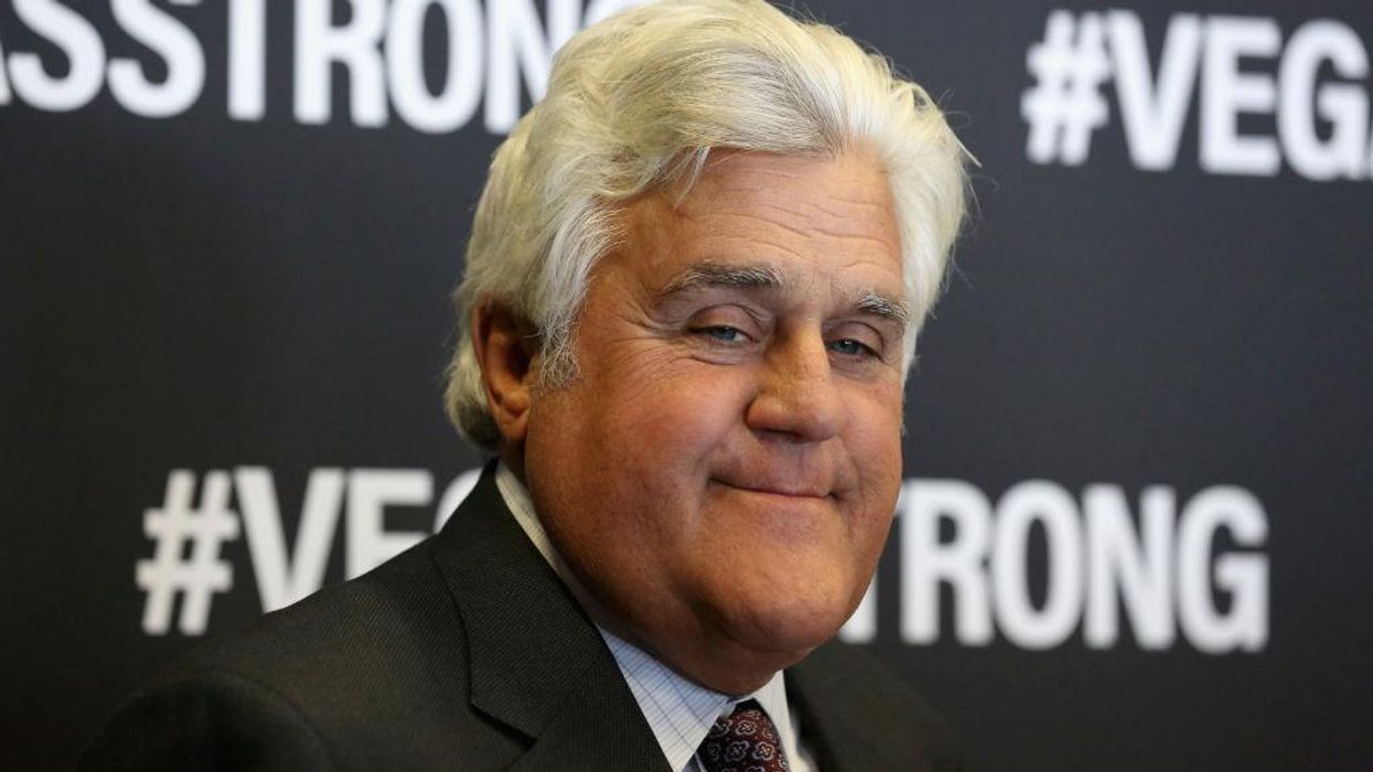 Not-so-funny comeback: Jay Leno hits cop car as he arrives at his first stage performance following fiery accident