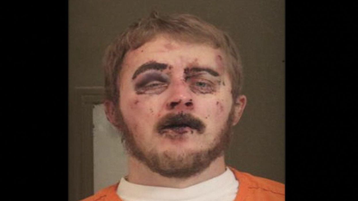 Thug allegedly tosses Molotov cocktail at cops — who tackle suspect, use baton strikes and 'pain-compliance techniques' when he resists arrest