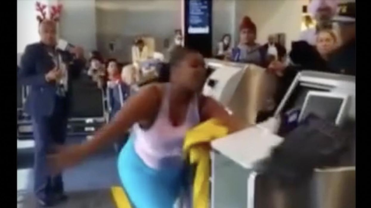 Video: Airline worker wearing holiday reindeer antlers hit by flying computer monitor — courtesy of passenger who loses it at gate, tosses equipment to ground