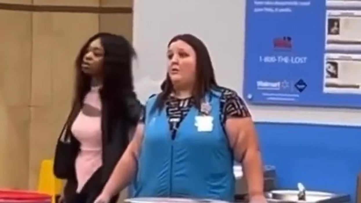'We're not doing that, crooked cop': Woman holding terrified Walmart employee at gunpoint is put down