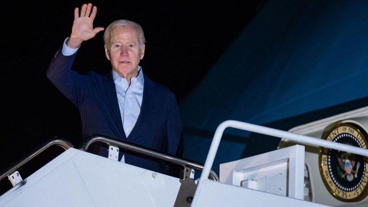 Biden virtue-signals about climate change while omnibus bill is flown to his tropical vacation spot