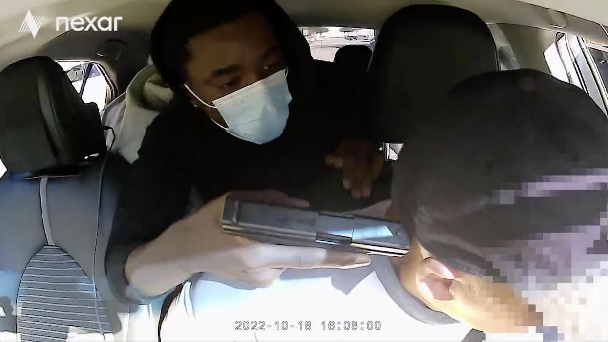 'Get out before I kill you!' Carjacker presses gun against Uber driver's head — but victim doesn't allow things to go down without a fight