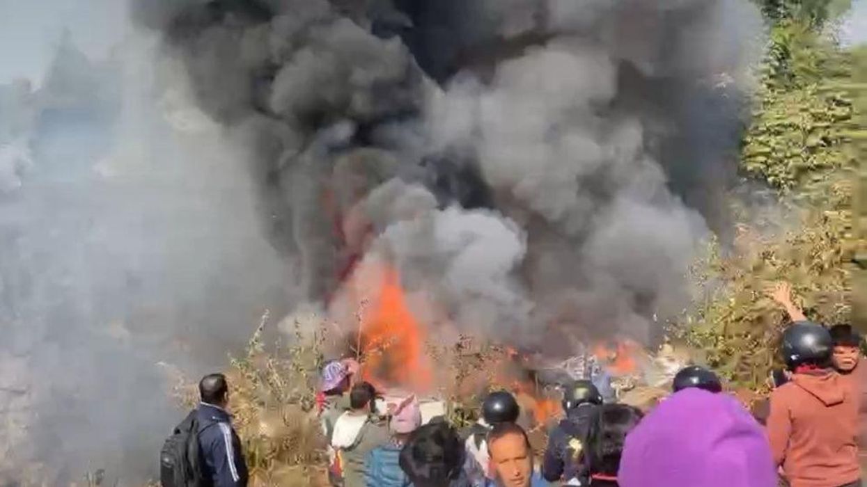 Chilling video shows passenger unwittingly capture final moments before plane crashes in Nepal, killing at least 68