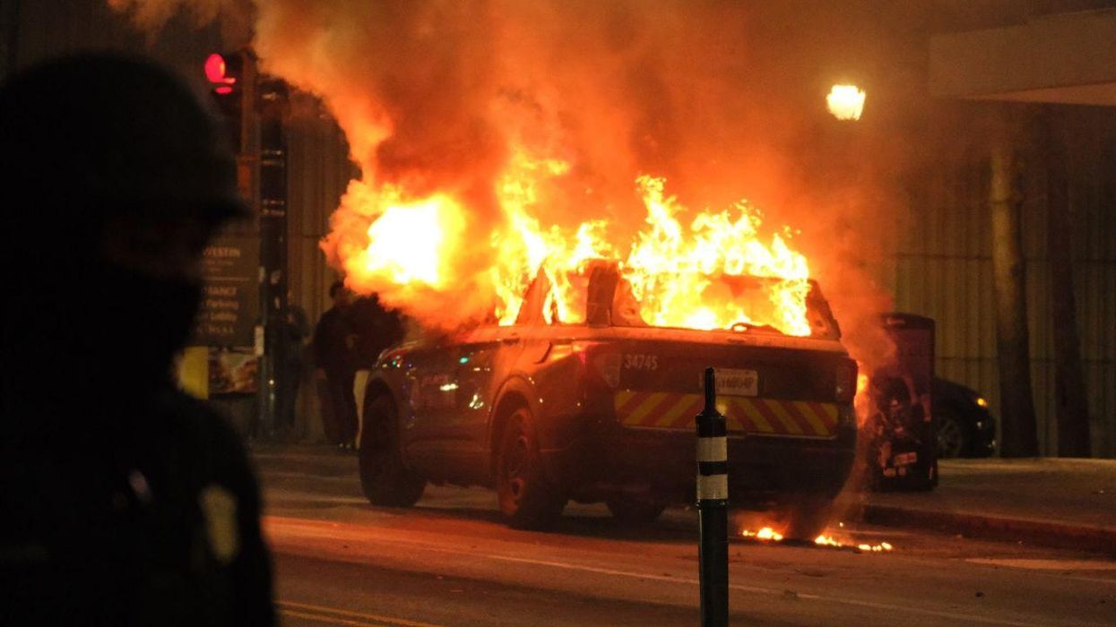 Gov declares state of emergency after rioters set police cars ablaze, shattered storefront windows in Atlanta