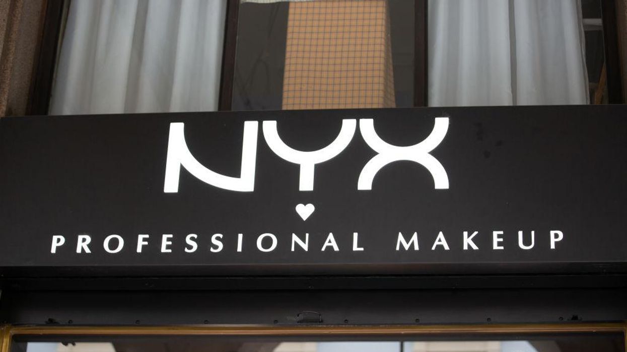 Woke makeup brand shares photo of what appears to be a bearded man wearing bright pink lip cream