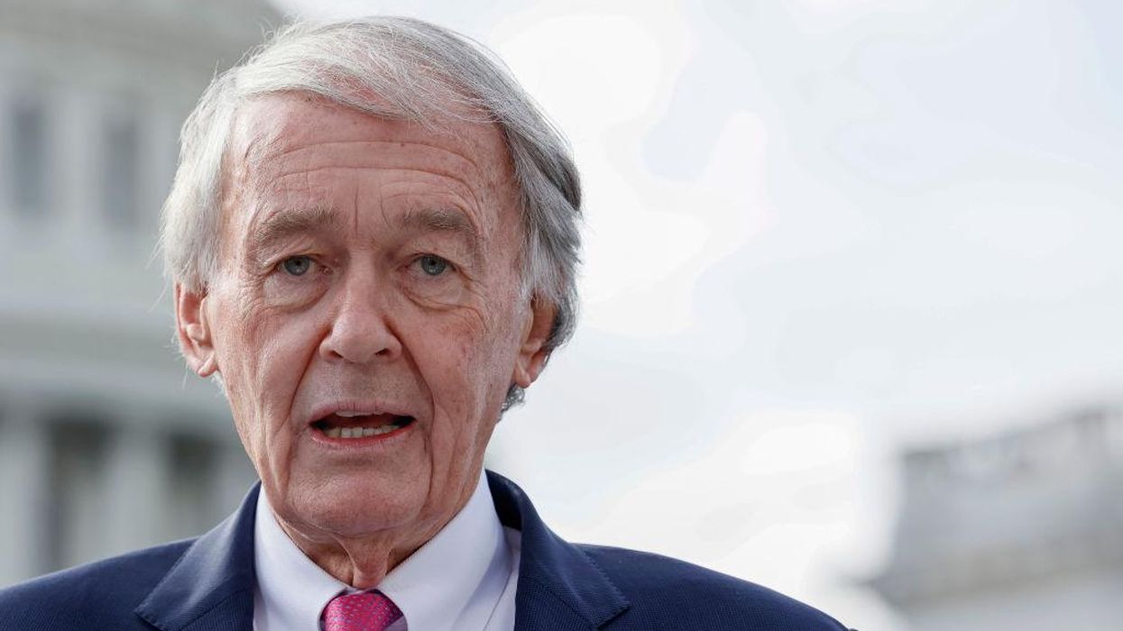 Democrats don 'ABORTION' pins with heart-shaped cutouts