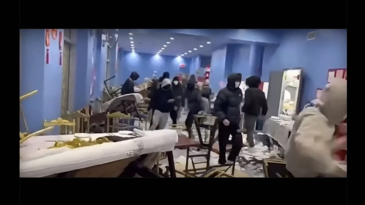 Masked, hooded teen mob caught on video trashing NYC restaurant, flipping tables and chairs — then quickly leaving 'with no money, no nothing, just to wreak havoc'