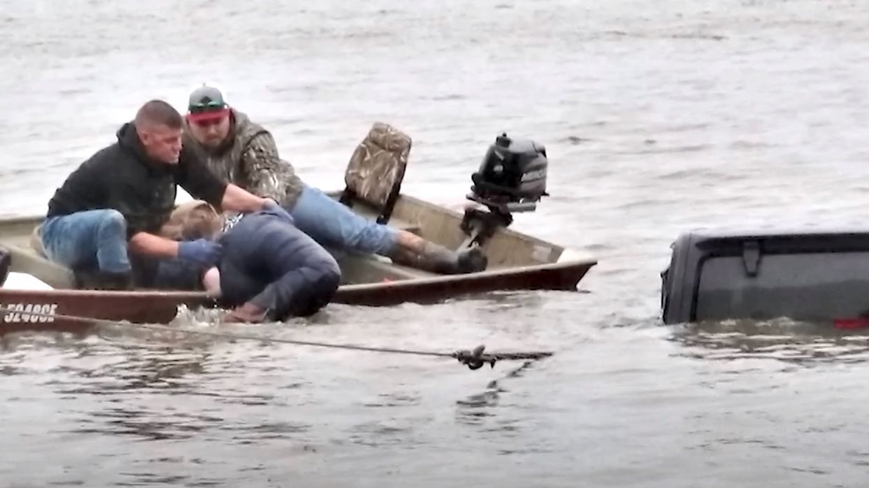 Jeep found submerged in a lake was being dragged out when a live woman was discovered inside. She had been missing for 2 days.
