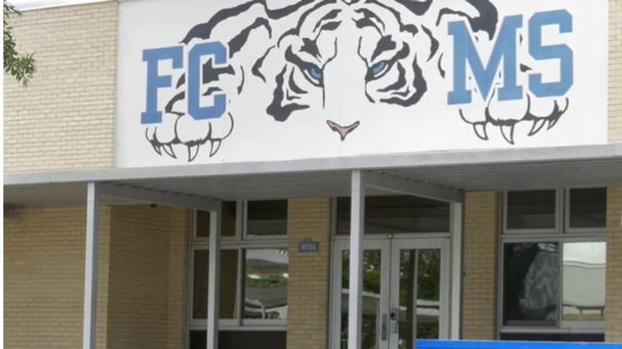 Male teacher posing as female suspended after threatening to shoot students