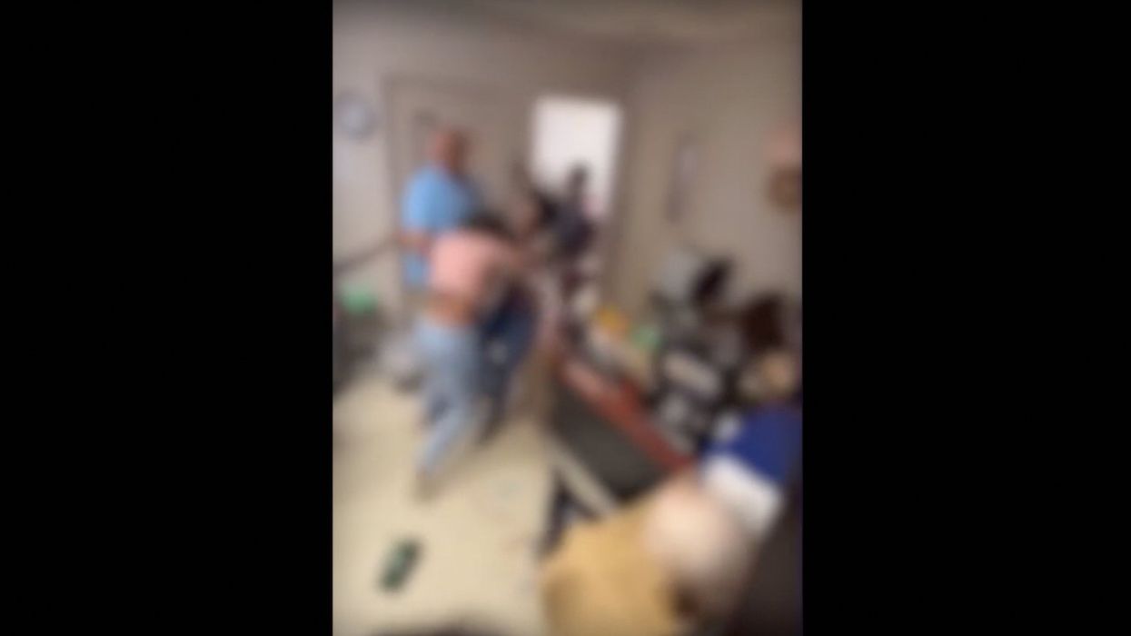 'Come out, b***h! Open the door!' Woman arrested after fight inside high school involving students