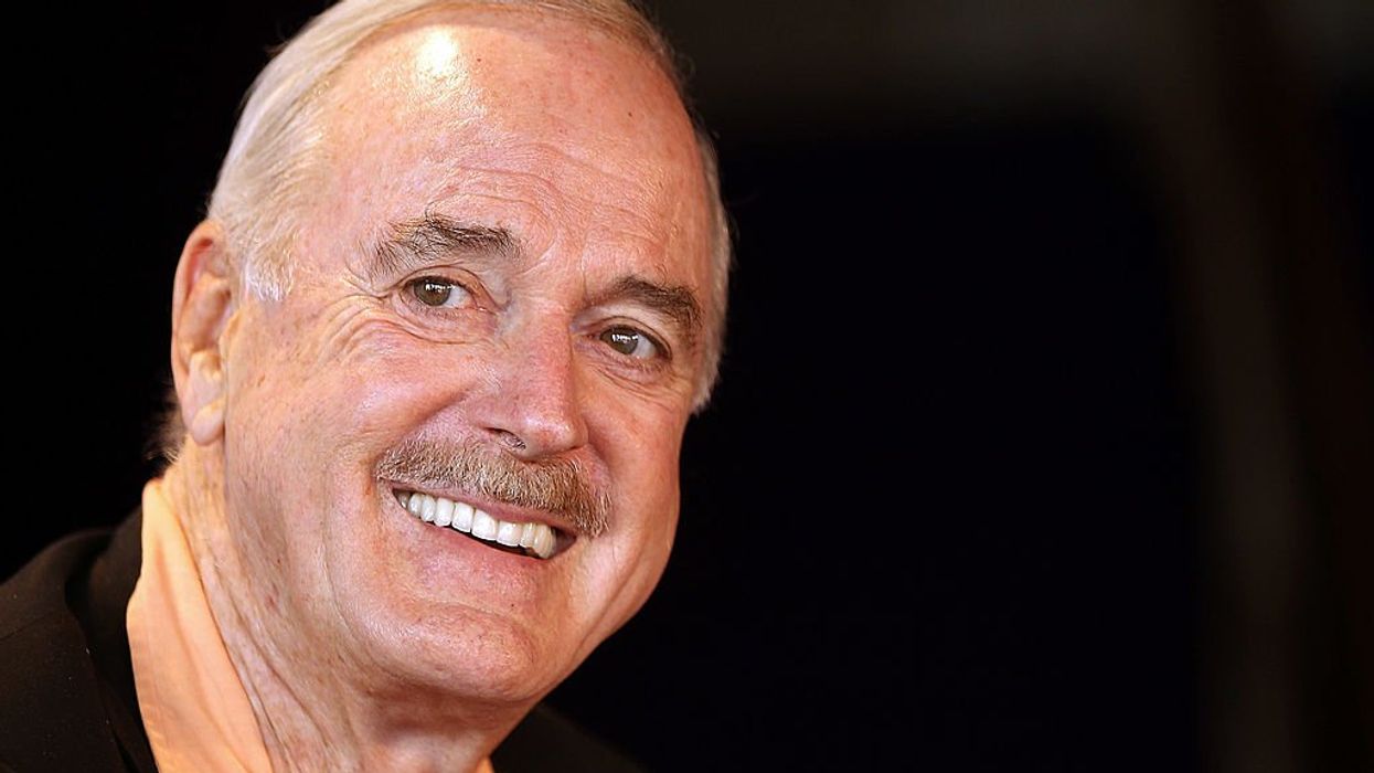 John Cleese refuses to remove 'Life of Brian' joke about a man becoming a woman and having a baby that critics call 'transphobic'