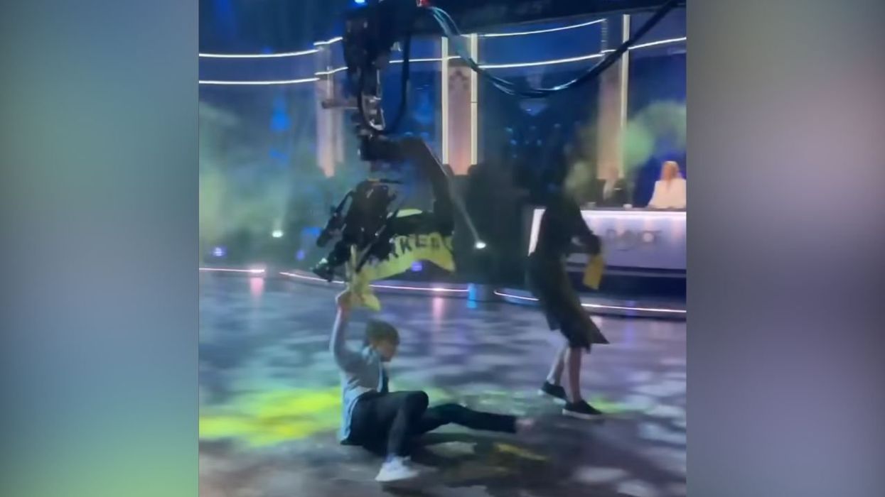 Video: Cameraman takes out climate activist who stormed on stage to disrupt live TV broadcast