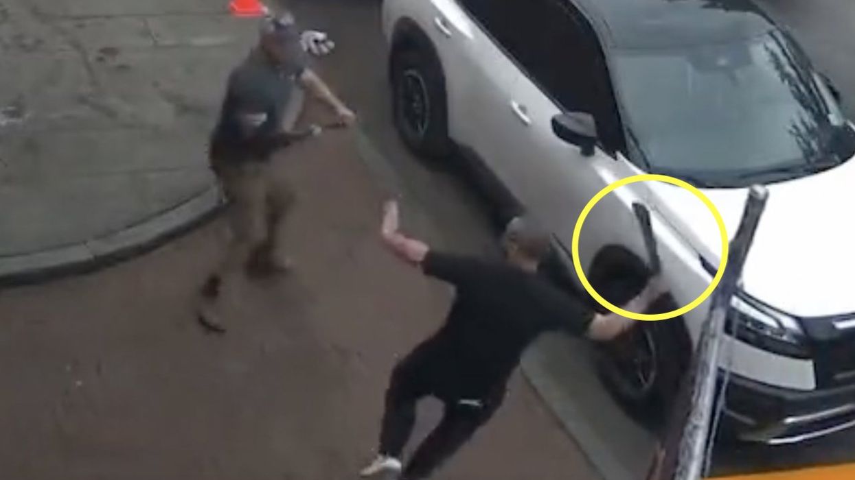 Video: Thugs take turns using machete to attack garage owner and his employees. Allegedly, the violence stems from a street-parking dispute.