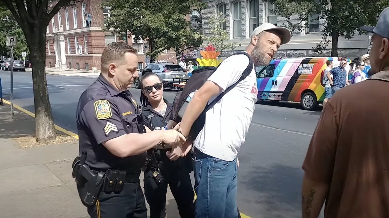 'Sheer tyranny': Man arrested after trying to quote Bible to Pride-rally attendees — who applaud when he's put in handcuffs