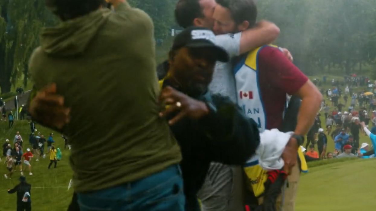 Professional PGA golfer tackled by security while trying to celebrate Nick Taylor's Canadian Open-winning, 72-foot putt