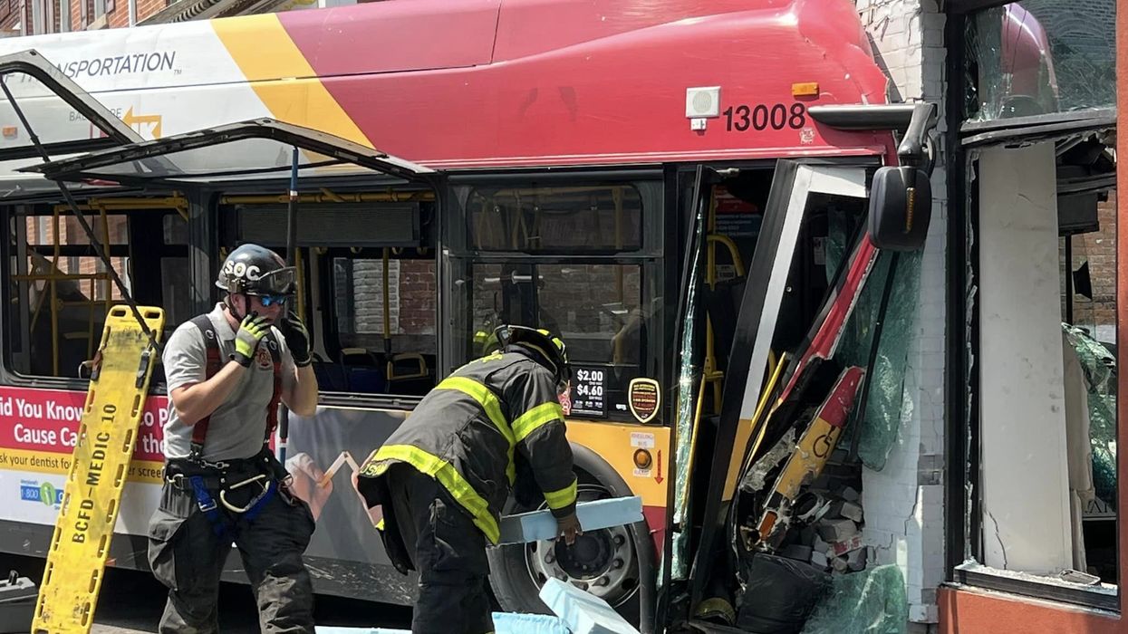 Multiple people injured when Baltimore bus collides with 2 vehicles, occupied building