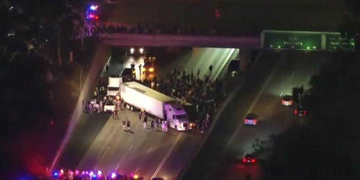 Protest Highway Protesters block highway with semi-truck, causing massive traffic ...
