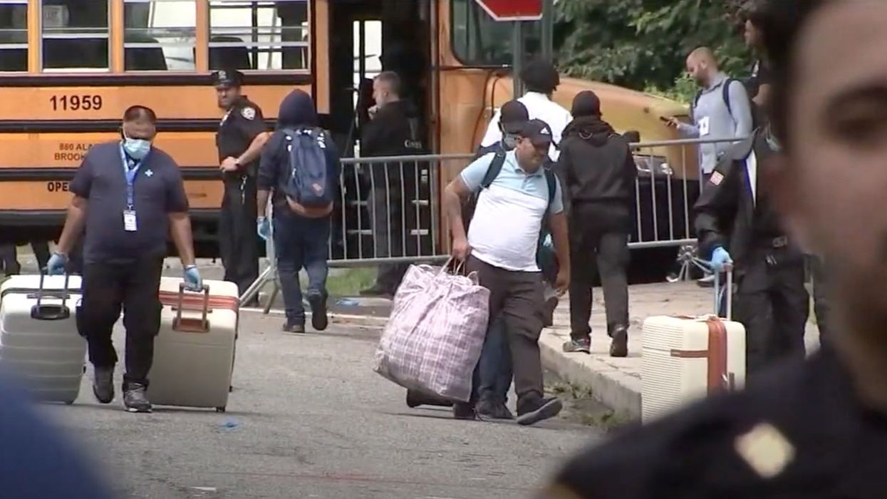 Asylum seekers refuse to leave NY high school after judge shuts down shelter as outraged residents protest: 'Go home! You're not welcome!'