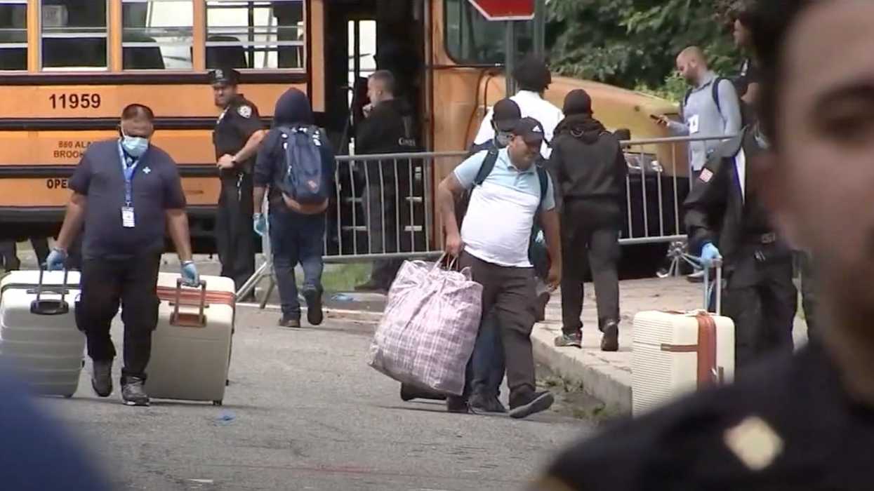 Asylum seekers refuse to leave NY high school after judge shuts down shelter as outraged residents protest: 'Go home! You're not welcome!'