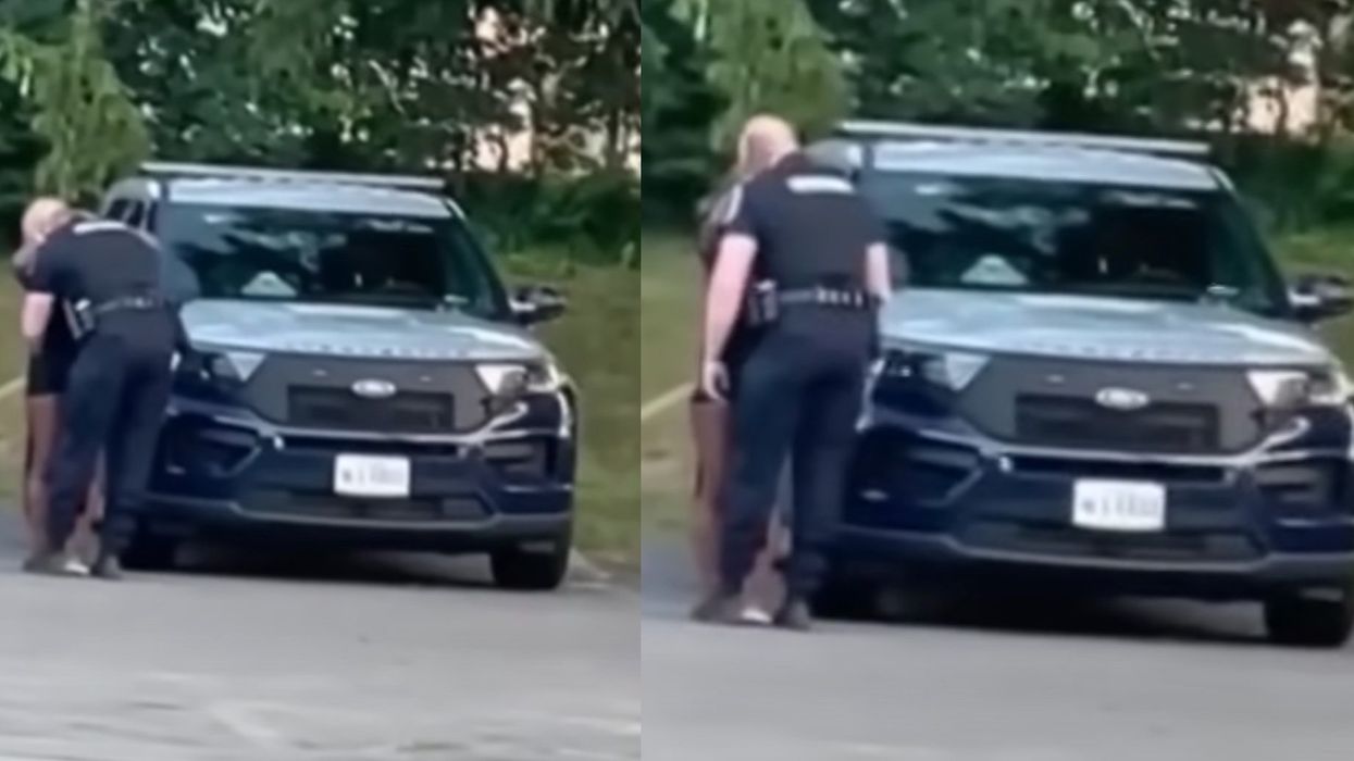 Cop suspended over viral video apparently showing him go into backseat of cruiser with woman, and his wife has responded