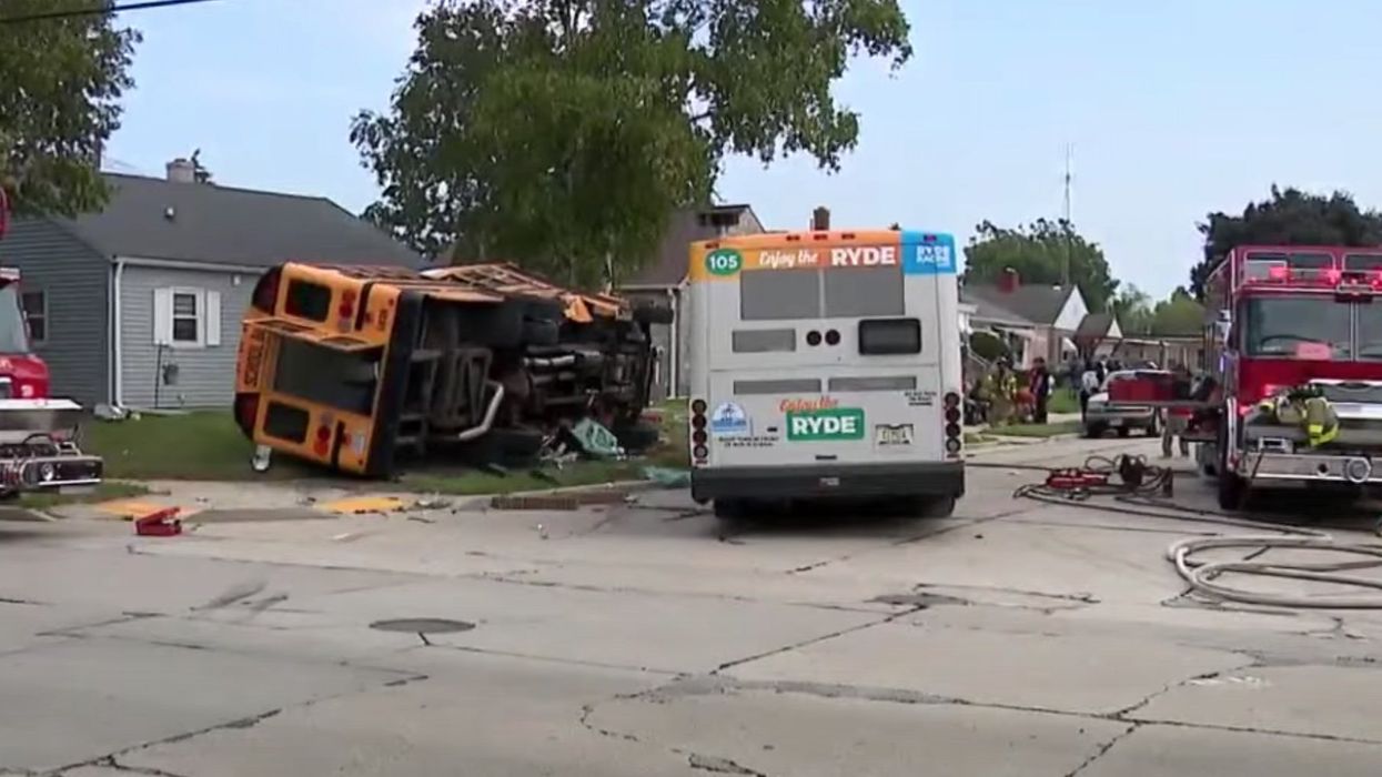 Security camera shows school bus blow through stop sign and get hit by city bus, 6 people hurt