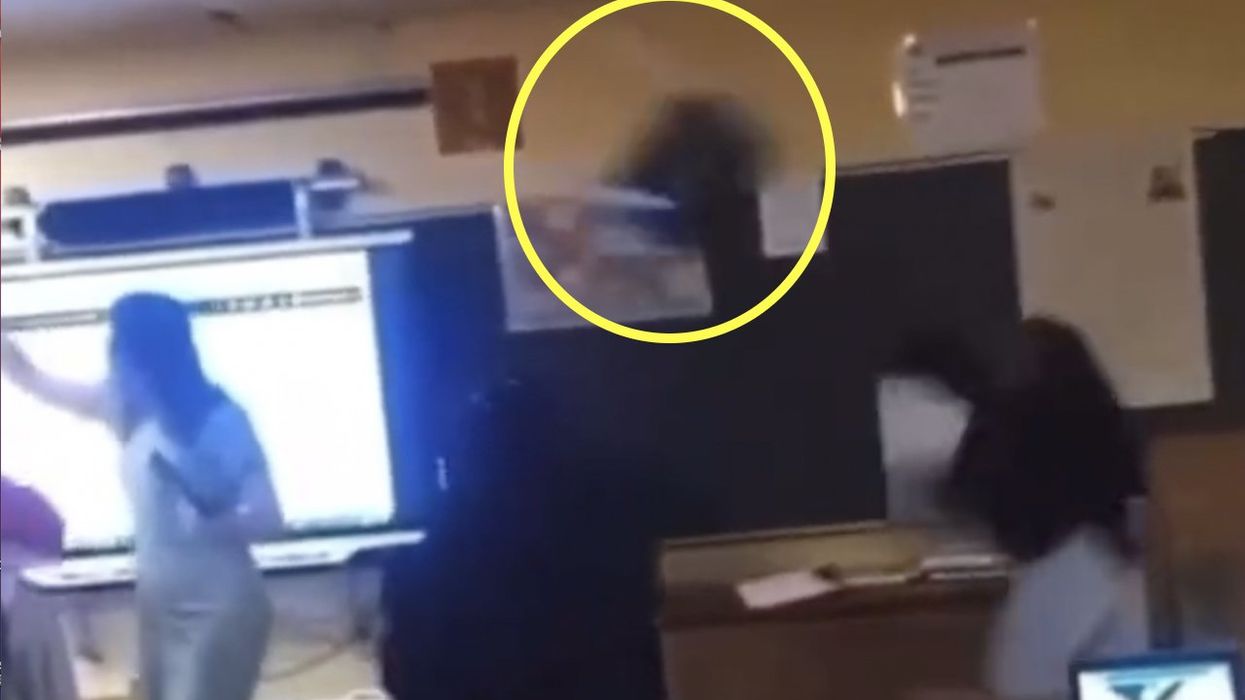HS student throws chair across classroom, hits teacher in head; victim hospitalized. Video purportedly of incident shows clobbered teacher knocked to floor.