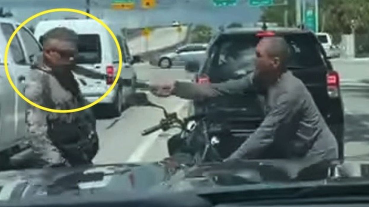 Dashcam footage shows horrifying moment angry motorist swings machete at motorbike rider in road-rage attack