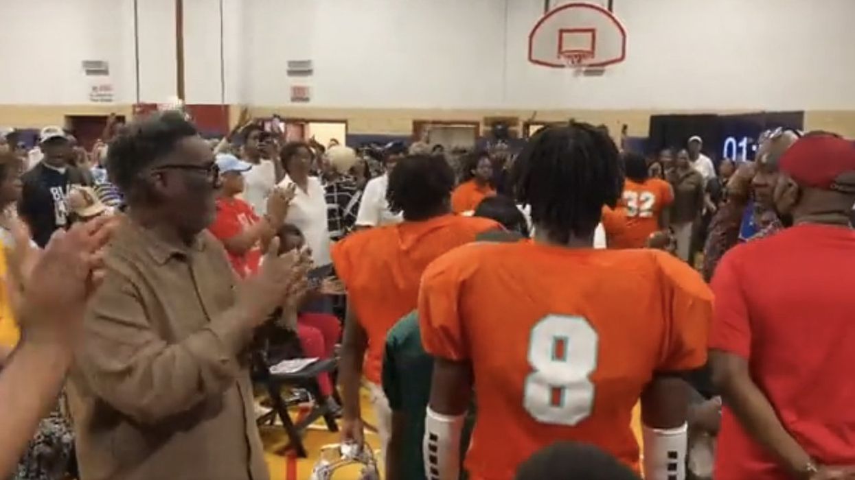 Video: Chicago youth football players protest getting booted from field house to make room for migrants; march into local meeting wearing their gear to wild cheers