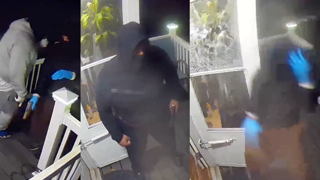 Shocking video shows three armed intruders break down door before homeowner makes them scatter with gunshots