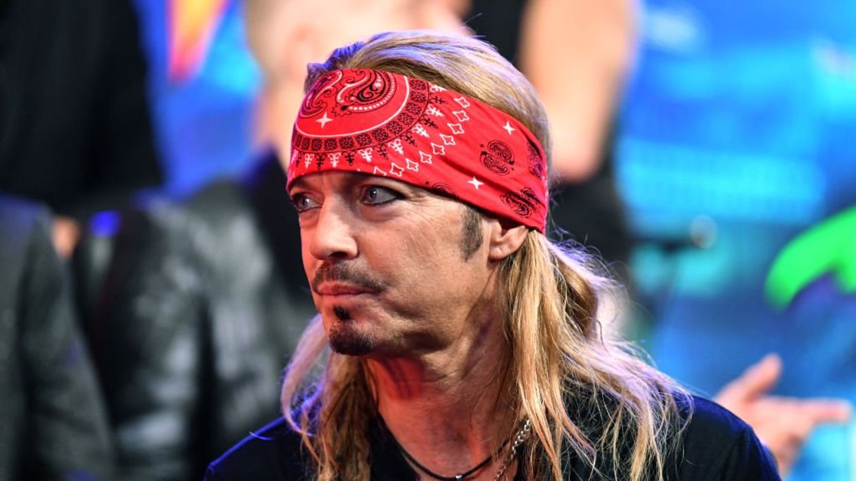 Rocker Bret Michaels adopts dog named Bret Michaels after the canine's blood was transfused into an ailing kitten