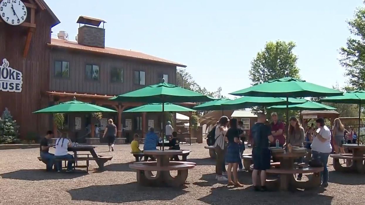 Armed man wearing tactical clothing with explosives found dead in women's restroom of Colorado theme park, police say he left a bizarre note