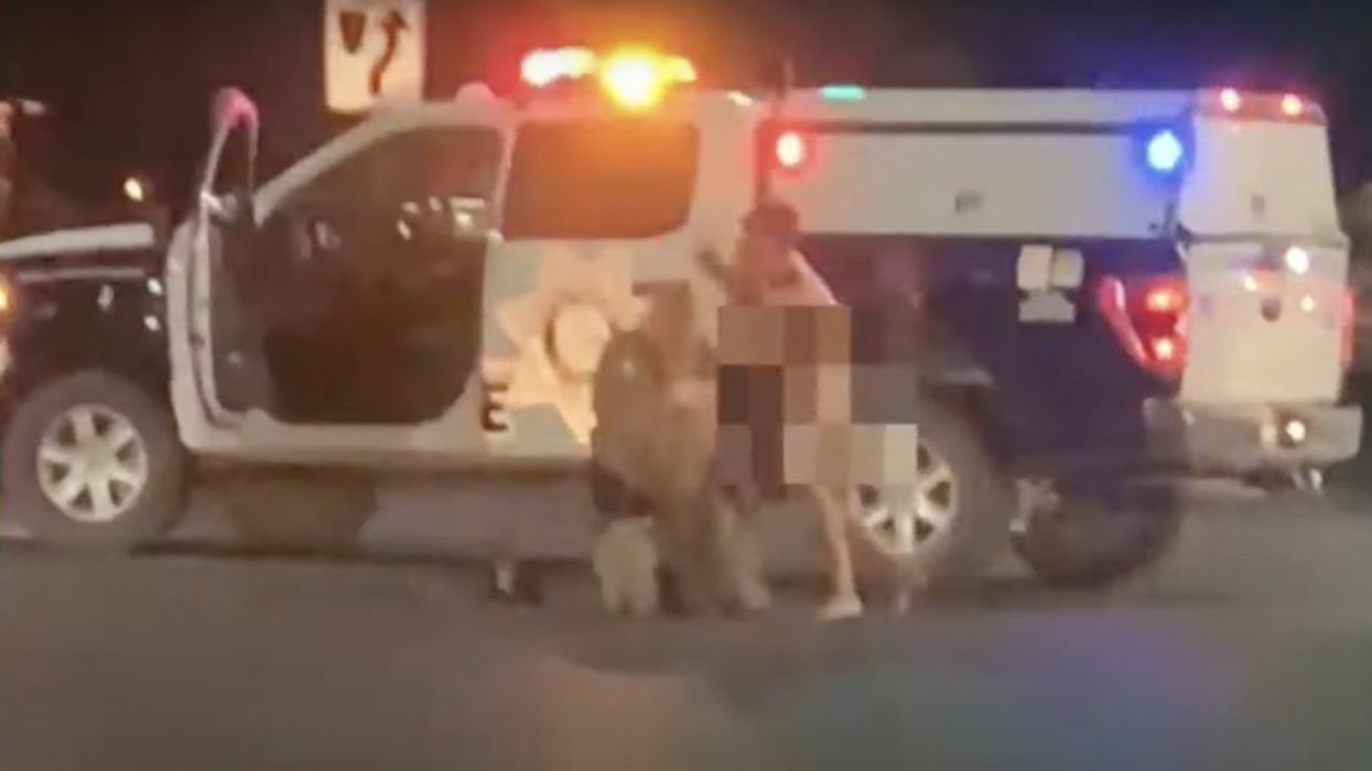 Naked man caught on video fighting Las Vegas cop in middle of road — then things take dangerous turn