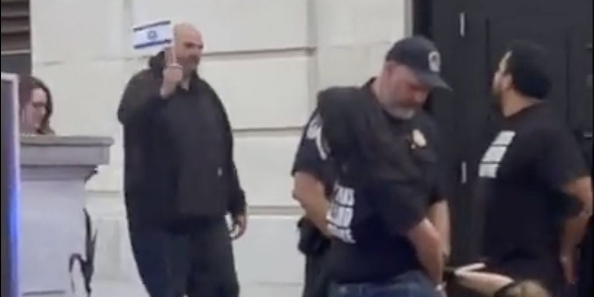 NextImg:Democrat John Fetterman waves Israeli flag right at furious, anti-Israel protesters getting handcuffed at US Capitol | Blaze Media