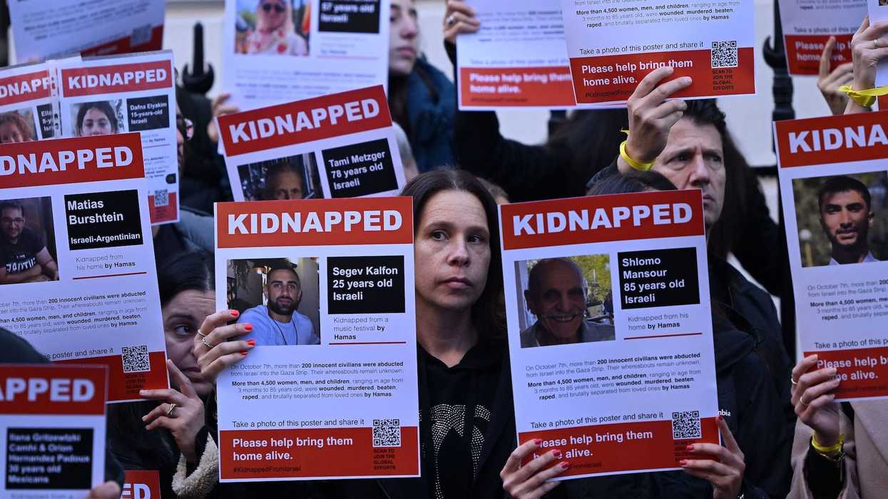 Israel approves deal to release Palestinian prisoners and pause military action in exchange for dozens of hostages