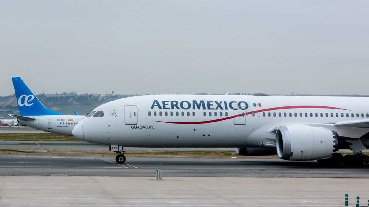 Passengers come to man's defense after he opened an emergency exit door and walked onto the plane's wing