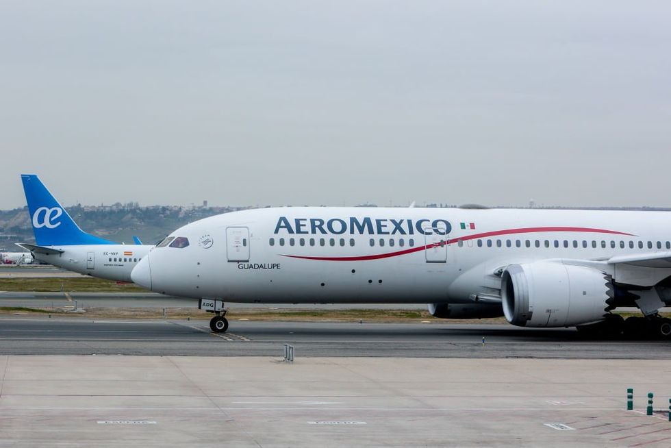 Passengers come to man's defense after he opened an emergency exit door and walked onto the plane's wing