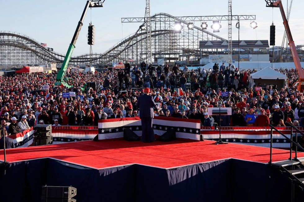 Trump says 'gloves are off' in handling 'moron' Biden at huge rally in deep-blue New Jersey, vows to fight America's enemies within
