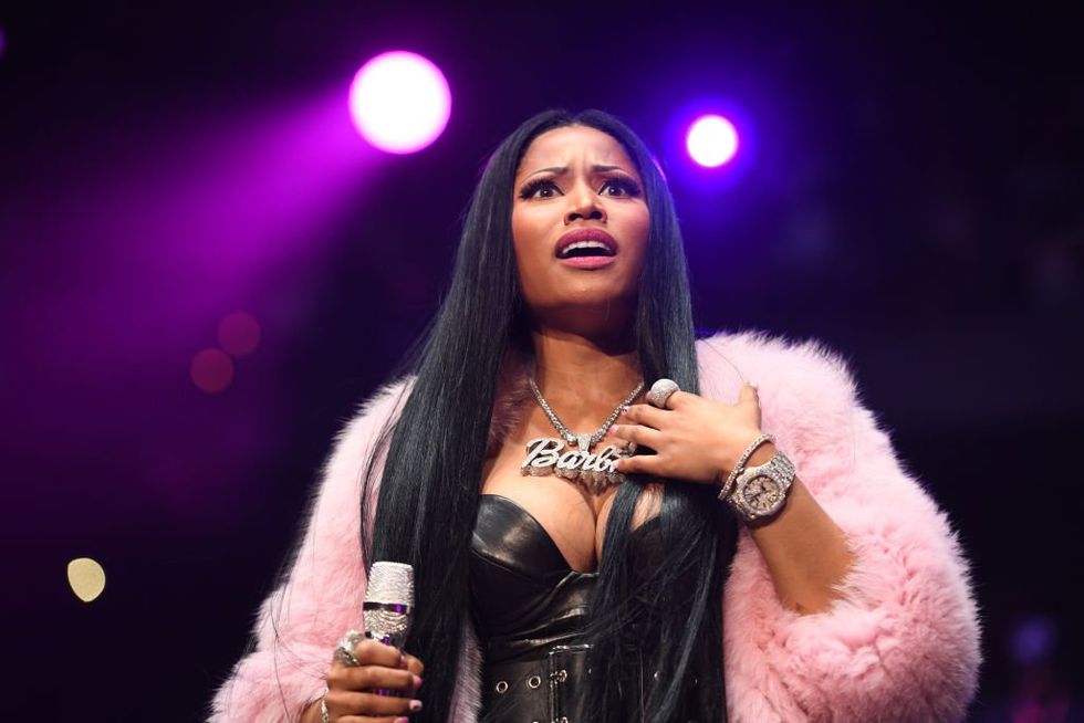 'Everything they've done is illegal': Watch Nicki Minaj film her arrest at Amsterdam airport for allegedly 'carrying drugs'