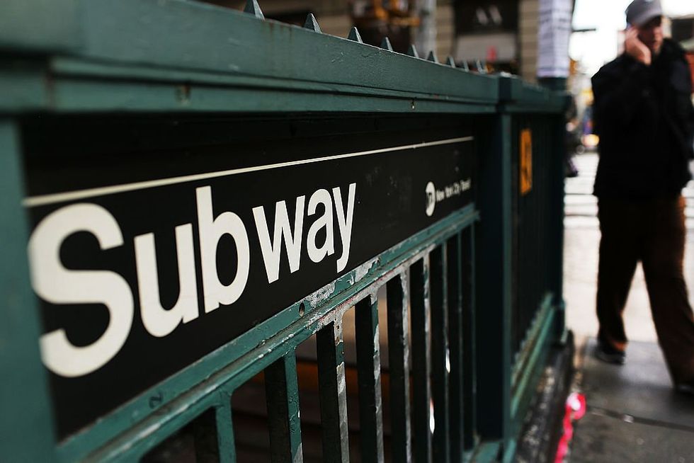 NYC subway rider set on fire after a man poured flaming liquid on him