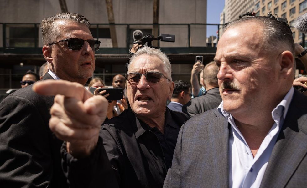 Robert De Niro's onscreen tough-guy persona appears to emerge amid verbal fisticuffs with Trump supporters in NYC