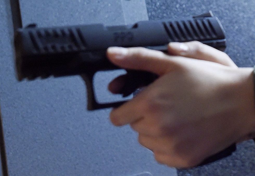 Armed crooks demand property from 53-year-old woman sitting in car. But she has a gun too — and opens fire.