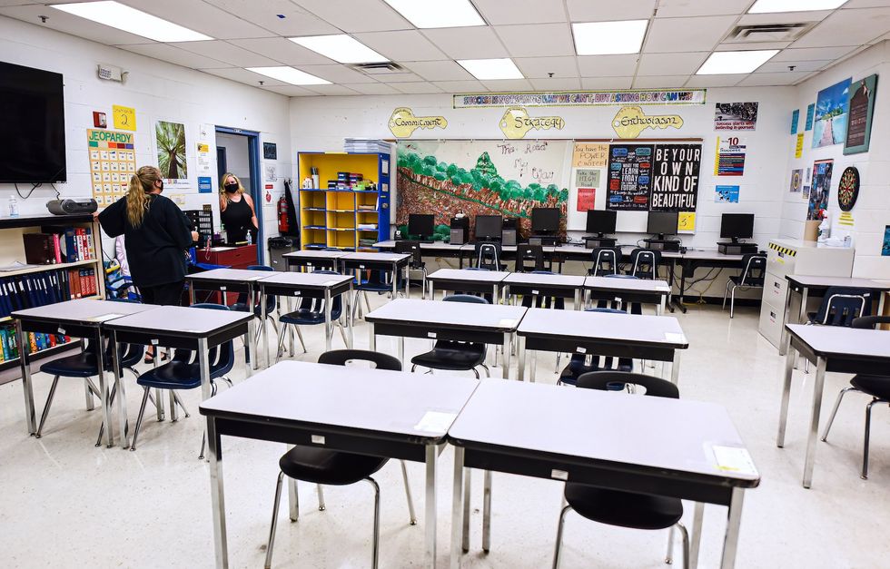 High school paints over pro-Trump designs made by students in parking spaces, but Texas officials are taking action